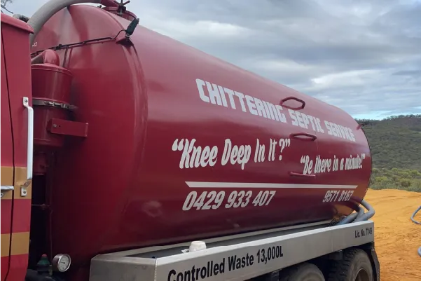 Chittering Septic Service vacuum tanker with the motto “Knee deep in it? Be there in a minute!” on the side