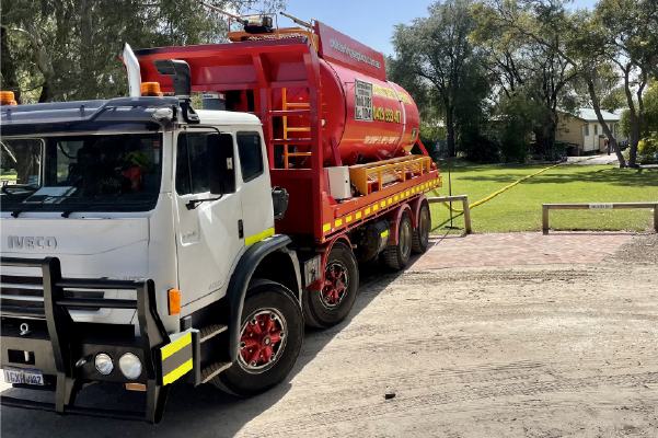 Chittering Septic Service tanker parked on a gravel driveway at a rural property